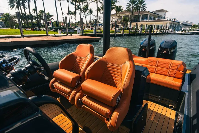 Slide: The Image of 2024 Onda Magna boat interior with luxurious leather seats and waterfront view. - 16