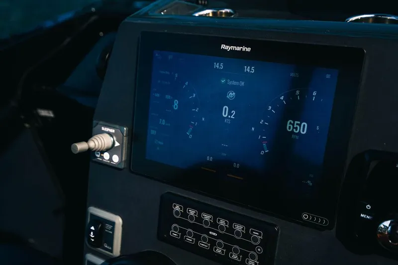 Slide: The Image of 2024 Onda Magna boat dashboard with Raymarine navigation display. - 21