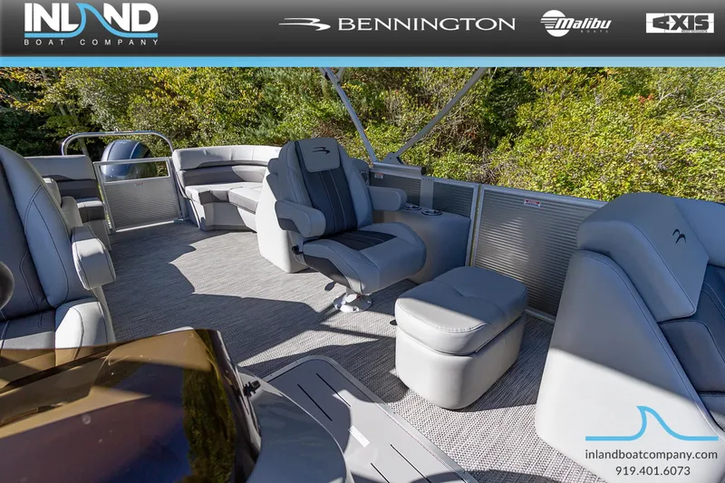 Slide: The Image of 2023 Bennington 22 SXSR pontoon boat interior with plush seating, showcased by Inland Boat Company. - 13