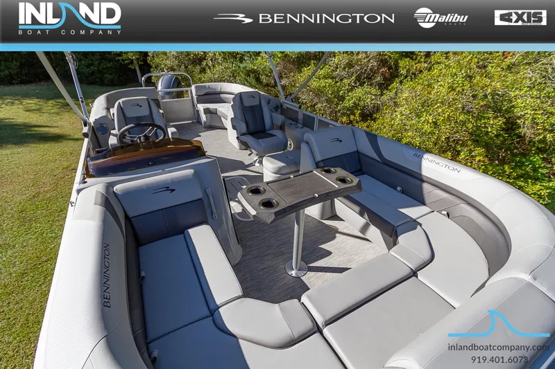 Slide: The Image of 2023 Bennington 22 SXSR pontoon boat interior with seating and table. - 14