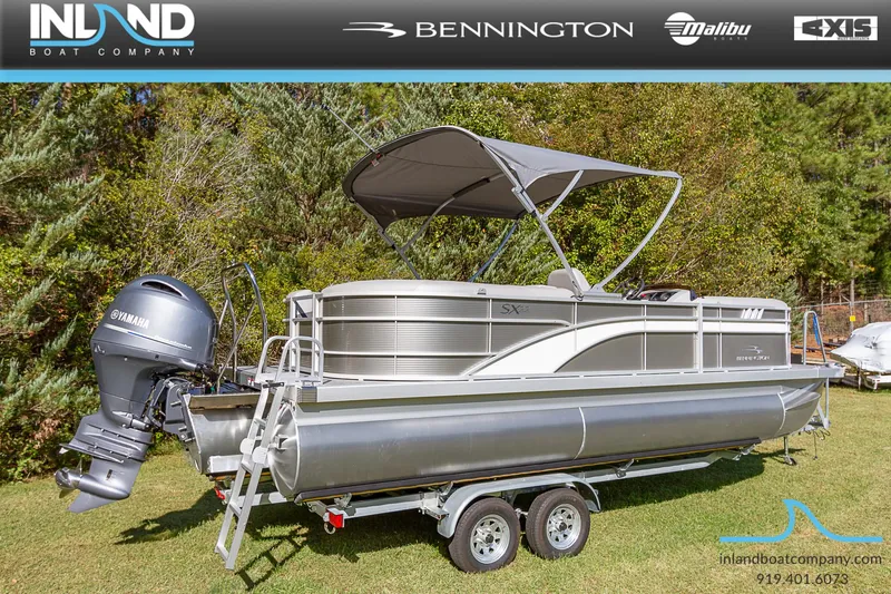 Slide: The Image of 2023 Bennington 22 SXSR pontoon boat on a trailer with Yamaha outboard motor. - 2