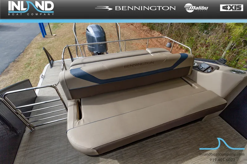 Slide: The Image of 2023 Bennington 22 SXSB boat interior with tan seating and rear motor. - 10