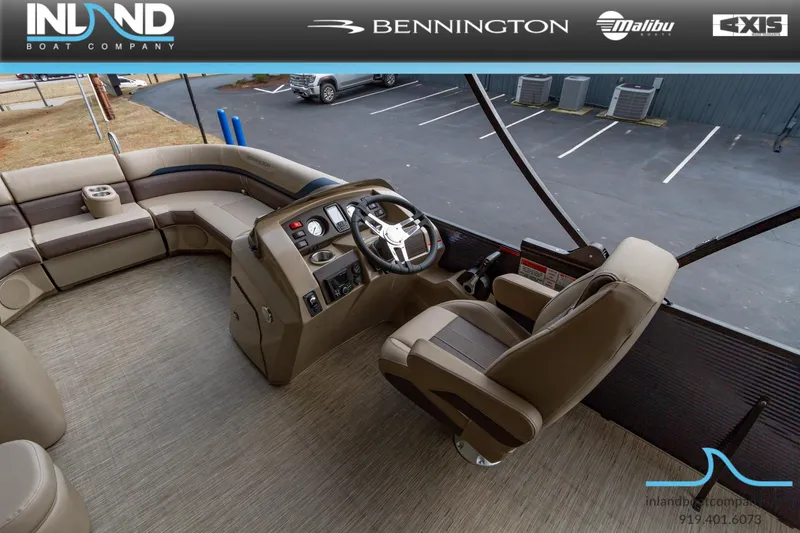 Slide: The Image of 2023 Bennington 22 SXSB boat interior with captain's chair and control console. - 11