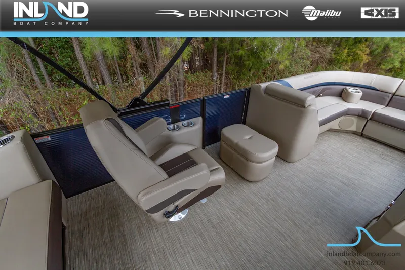 Slide: The Image of 2023 Bennington 22 SXSB boat interior with beige seating and cup holders. - 12