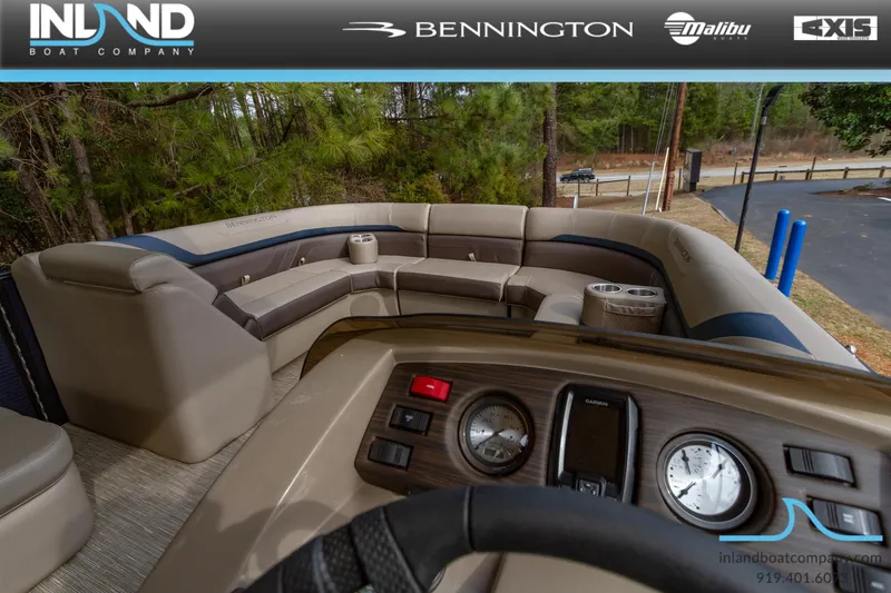 Slide: The Image of 2023 Bennington 22 SXSB boat interior with luxurious seating and modern dashboard. - 17
