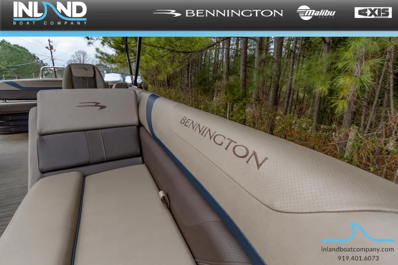 Slide: The Image of 2023 Bennington 22 SXSB boat interior with branded seating, showcased by Inland Boat Company. - 24
