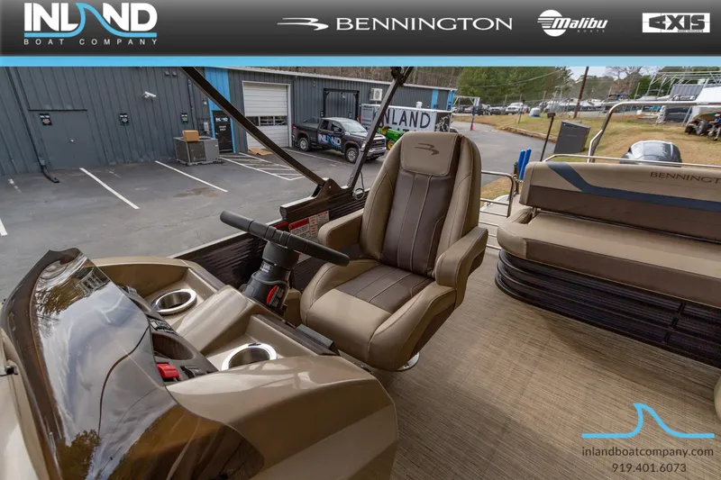 Slide: The Image of 2023 Bennington 22 SXSB boat interior with captain's chair and console at Inland Boat Company. - 25