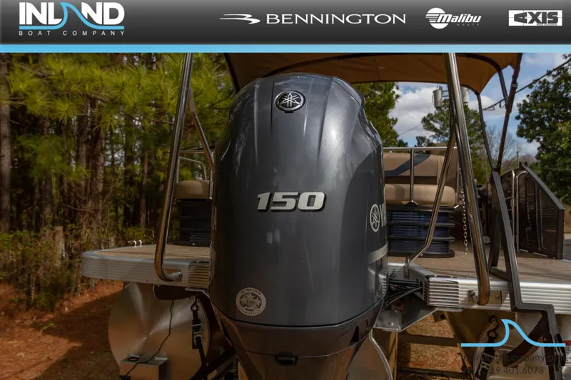 Slide: The Image of 2023 Bennington 22 SXSB pontoon boat with a 150 HP engine, rear view. - 6