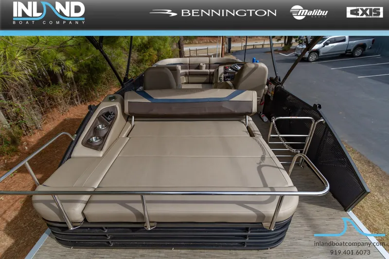 Slide: The Image of 2023 Bennington 22 SXSB pontoon boat with spacious seating and modern amenities. - 7