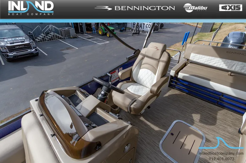 Slide: The Image of 2023 Bennington 23 LTSB boat interior with captain's chair and dashboard. - 11