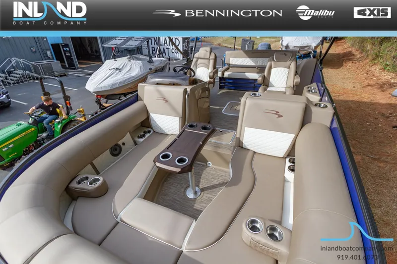 Slide: The Image of 2023 Bennington 23 LTSB pontoon boat interior with luxurious seating and cup holders. - 16