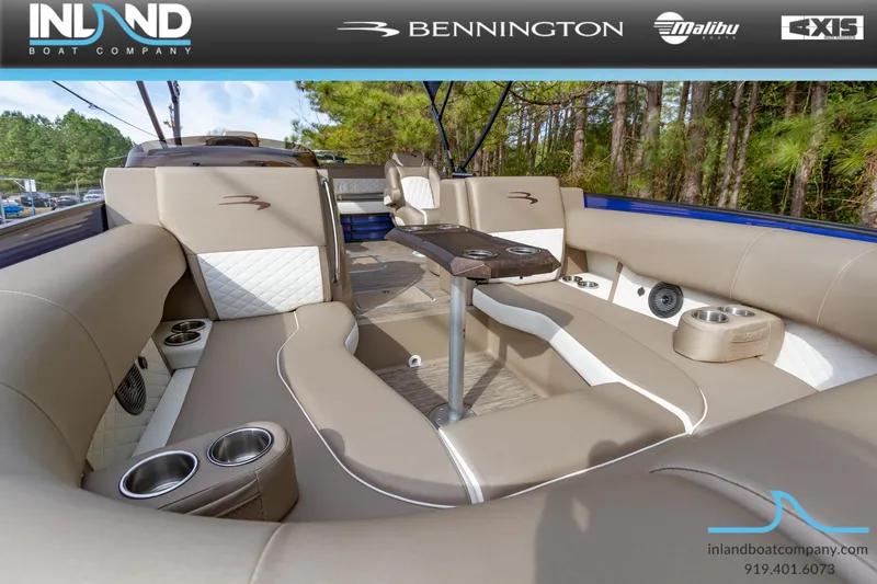 Slide: The Image of 2023 Bennington 23 LTSB pontoon boat interior with beige seating and table. - 18