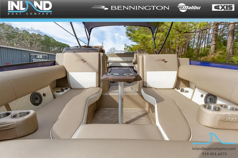 Slide: The Image of 2023 Bennington 23 LTSB luxury pontoon boat interior with beige seating and table. - 19