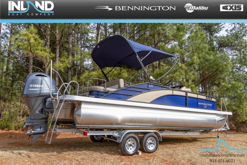 Slide: The Image of 2023 Bennington 23 LTSB pontoon boat on trailer with Yamaha outboard motor. - 2