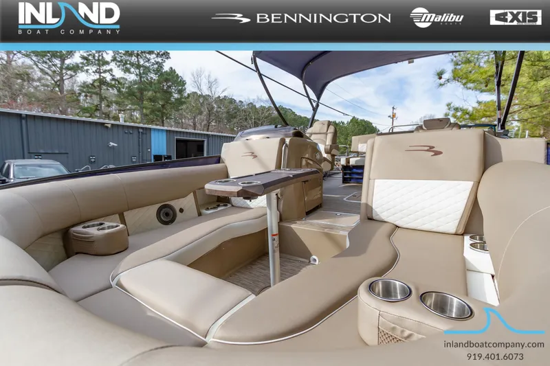 Slide: The Image of 2023 Bennington 23 LTSB pontoon boat interior with luxurious seating and cup holders. - 20