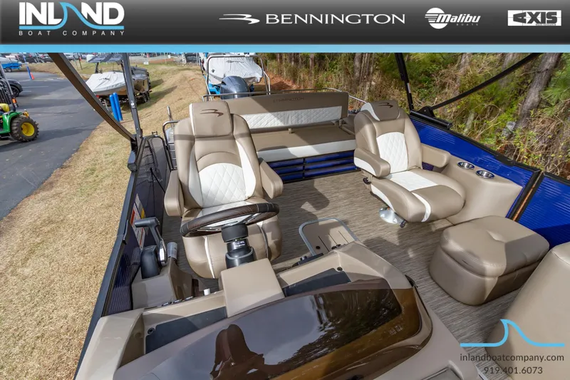 Slide: The Image of 2023 Bennington 23 LTSB pontoon boat interior with luxurious seating and helm. - 23