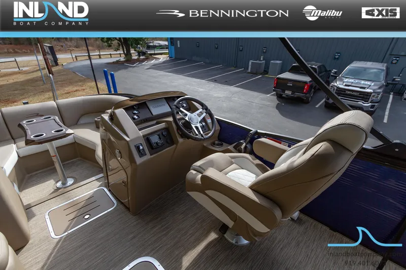 Slide: The Image of 2023 Bennington 23 LTSB boat interior with captain's chair and control console. - 9