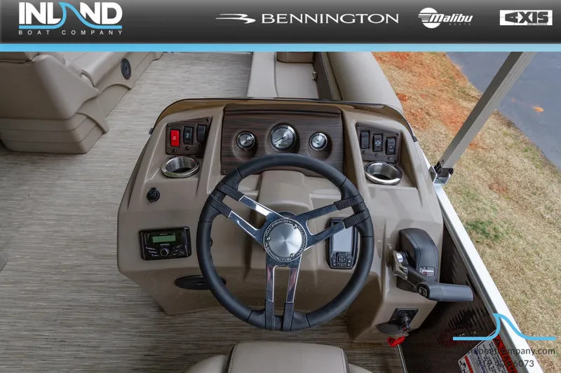 Slide: The Image of 2023 Bennington 22 SL boat dashboard with steering wheel and control panel. - 15