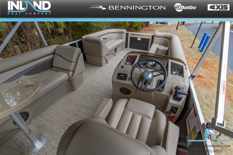 Slide: The Image of Interior of 2023 Bennington 22 SL pontoon boat with beige seating and steering console. - 16