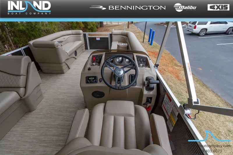 Slide: The Image of 2023 Bennington 22 SL boat interior with steering console and seating. - 17