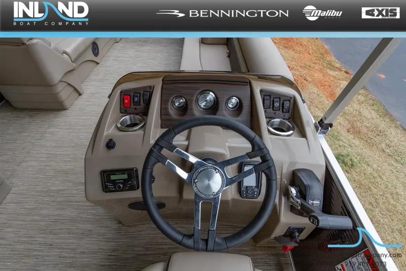 Slide: The Image of 2023 Bennington 22 SL boat dashboard with steering wheel and control panel. - 18