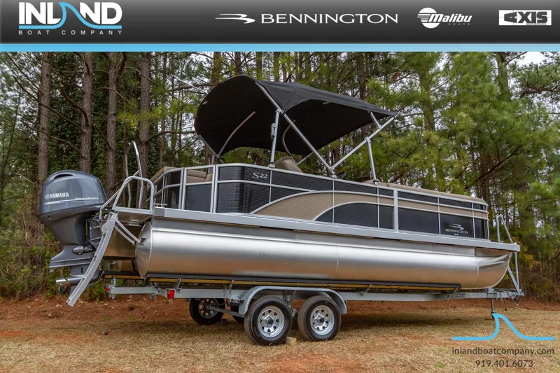 Slide: The Image of 2023 Bennington 22 SL pontoon boat on trailer with Yamaha outboard motor. - 2