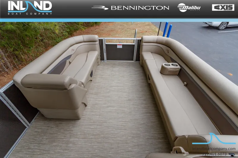 Slide: The Image of 2023 Bennington 22 SL pontoon boat interior with beige seating and cup holders. - 20
