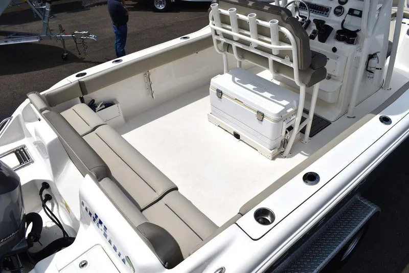 Slide: The Image of 2022 Key West 239FS boat interior with seating and console. - 10