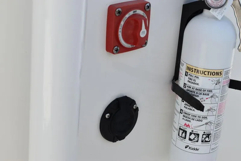 Slide: The Image of 2022 Key West 239FS boat with fire extinguisher and power switch. - 15
