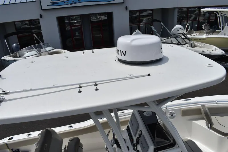 Slide: The Image of 2022 Key West 239FS boat with Garmin radar, docked at a marina. - 17
