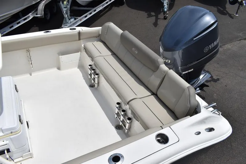 Slide: The Image of 2022 Key West 239FS boat with Yamaha engine and beige seating. - 18