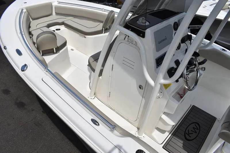 Slide: The Image of 2022 Key West 239FS boat interior with seating and console. - 21