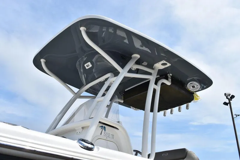 Slide: The Image of 2022 Key West 239FS boat with T-top against blue sky. - 23