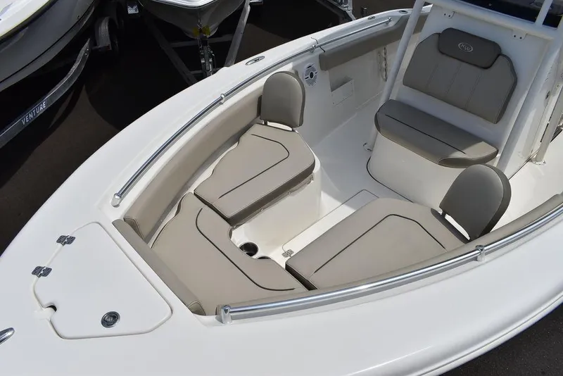 Slide: The Image of 2022 Key West 239FS boat interior with cushioned seating and sleek design. - 26