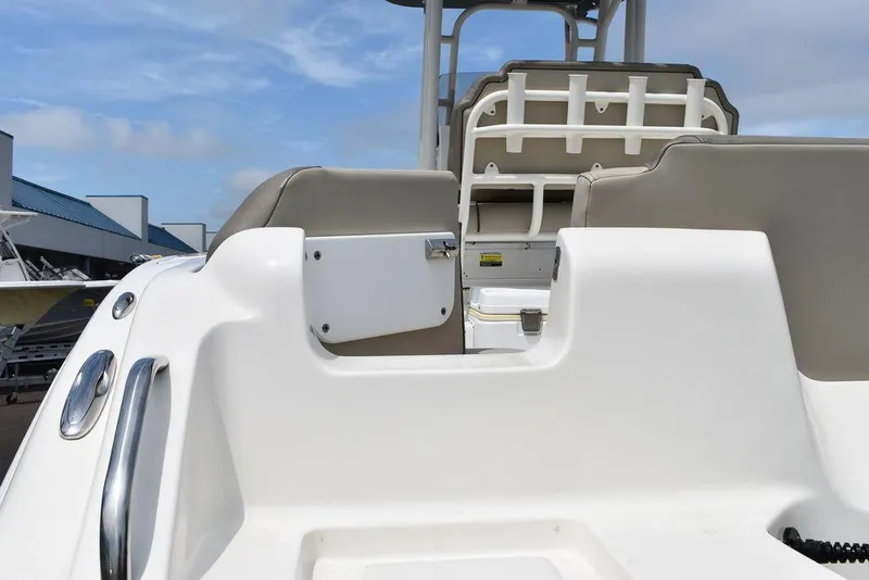 Slide: The Image of 2022 Key West 239FS boat interior with seating and storage compartments. - 29