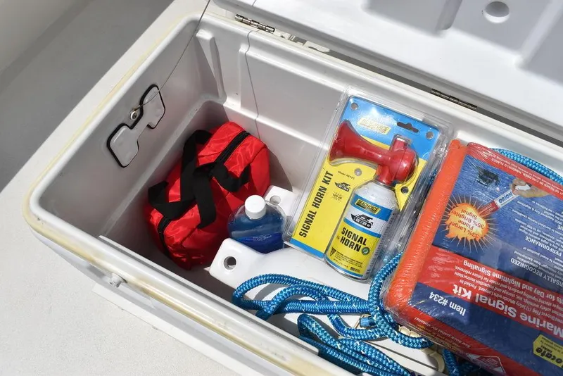 Slide: The Image of Key West 239FS 2022 boat storage with safety gear and signal kit. - 33