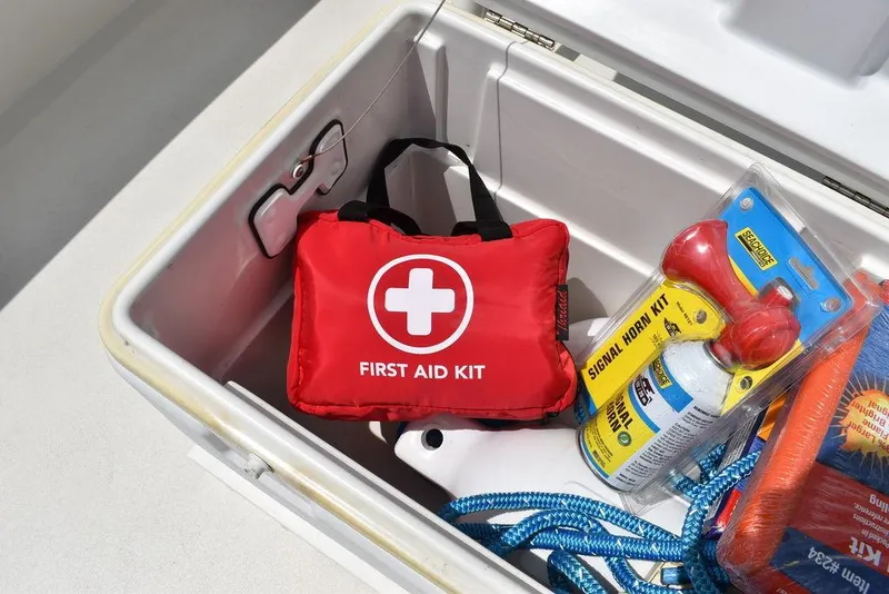 Slide: The Image of First aid kit and safety gear in Key West 239FS boat storage, 2022 model. - 34