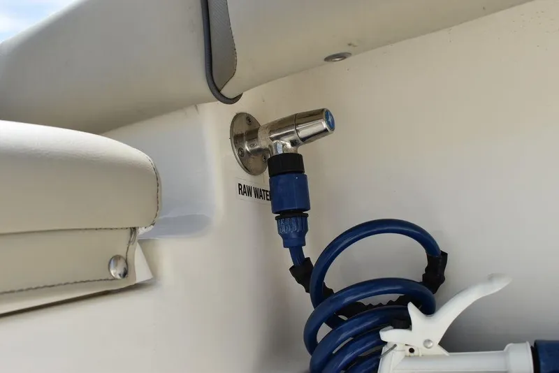 Slide: The Image of 2022 Key West 239FS boat raw water hose connection detail. - 37