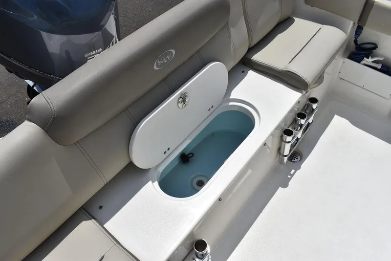 Slide: The Image of 2022 Key West 239FS boat interior with seating and storage compartment. - 38