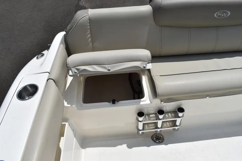 Slide: The Image of 2022 Key West 239FS boat interior with storage compartment and rod holders. - 39