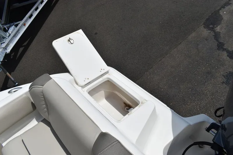 Slide: The Image of 2022 Key West 239FS boat with open storage compartment on deck. - 40