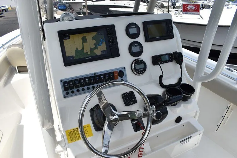 Slide: The Image of 2022 Key West 239FS boat dashboard with navigation and control instruments. - 49