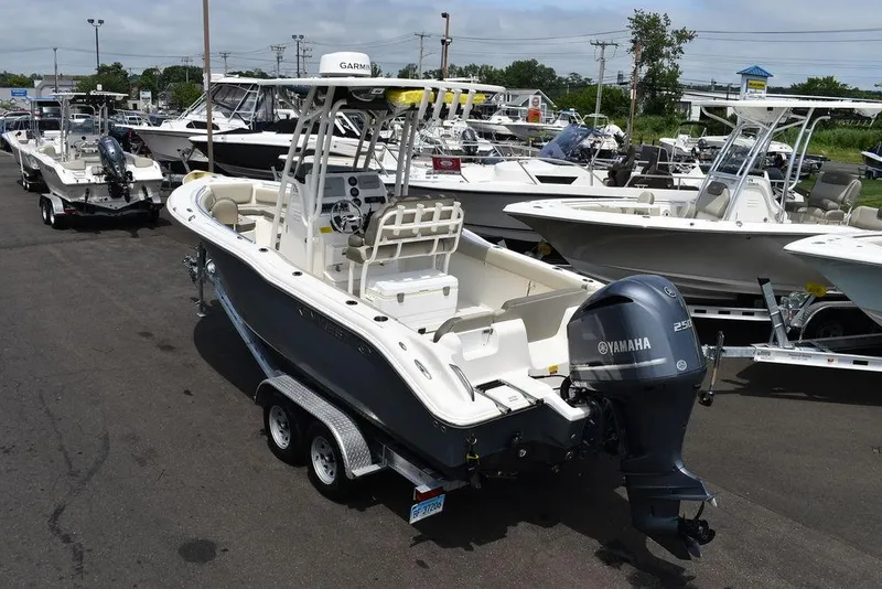 Slide: The Image of 2022 Key West 239FS boat with Yamaha engine on trailer in marina. - 5