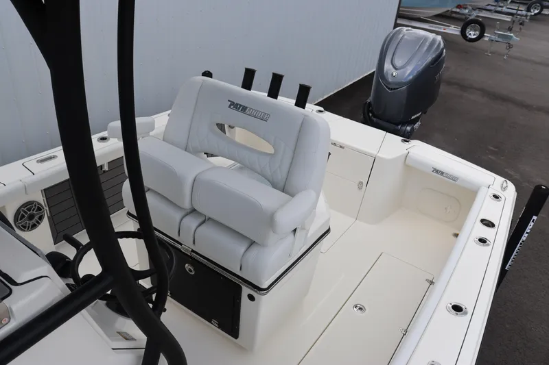 Slide: The Image of 2024 Pathfinder 2400 Open boat interior with white seating and outboard motor. - 10
