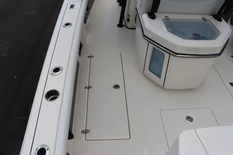 Slide: The Image of 2024 Pathfinder 2400 Open boat deck with storage compartments and rod holders. - 15
