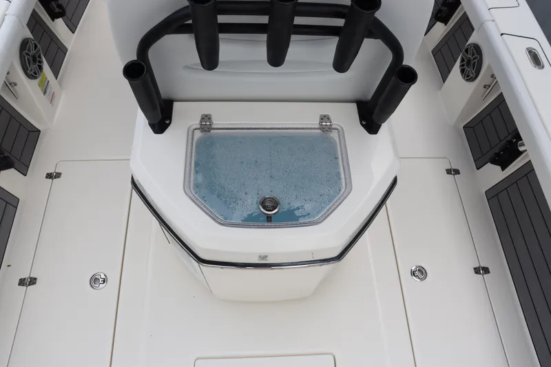 Slide: The Image of 2024 Pathfinder 2400 Open boat interior with livewell and rod holders. - 16