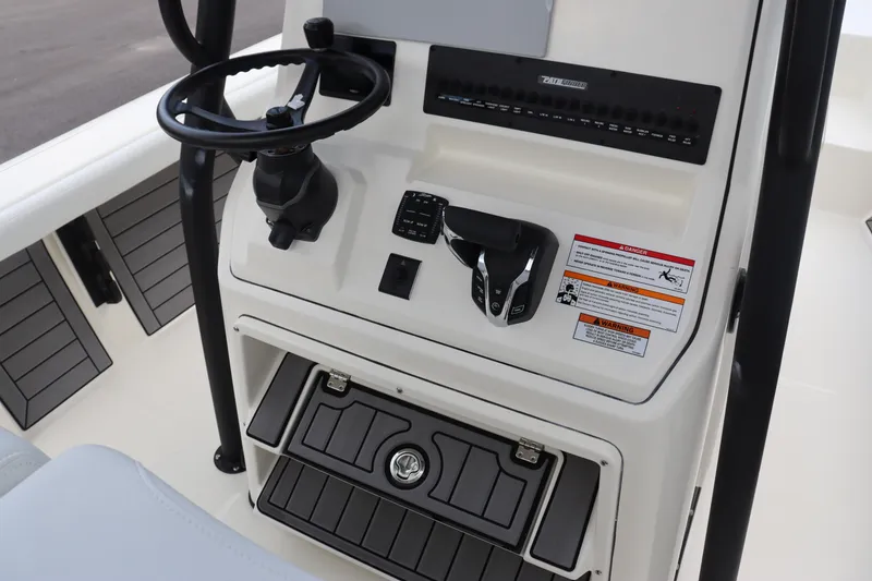 Slide: The Image of 2024 Pathfinder 2400 Open boat console with steering wheel and controls. - 18