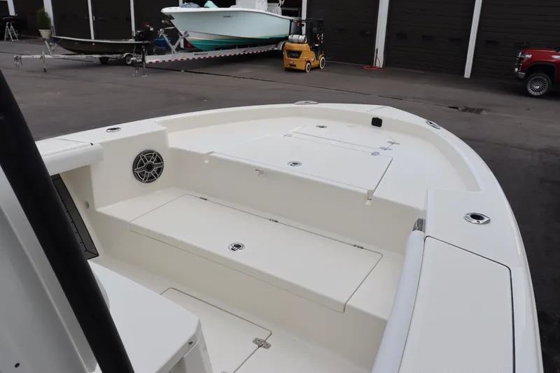 Slide: The Image of 2024 Pathfinder 2400 Open boat interior, spacious deck with storage compartments. - 27