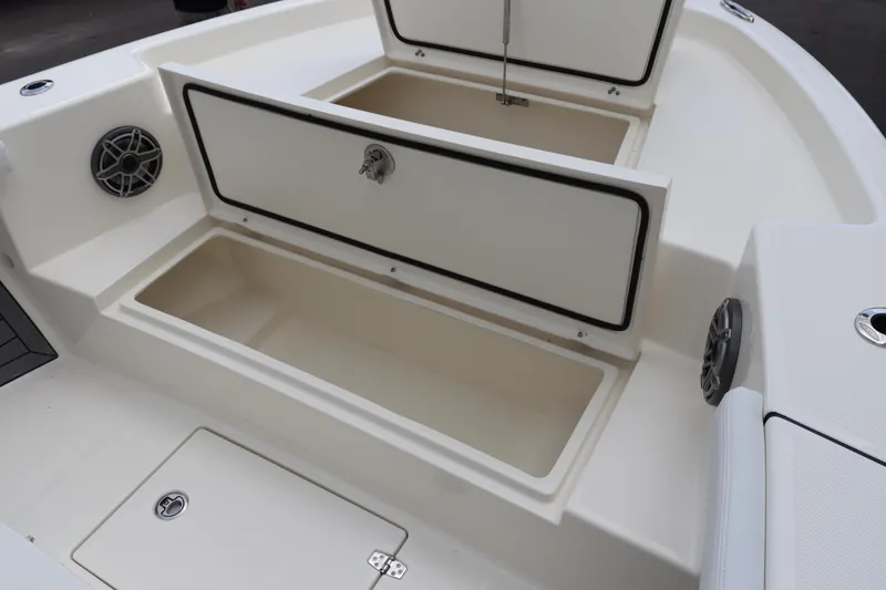 Slide: The Image of 2024 Pathfinder 2400 Open boat storage compartments and speakers. - 29
