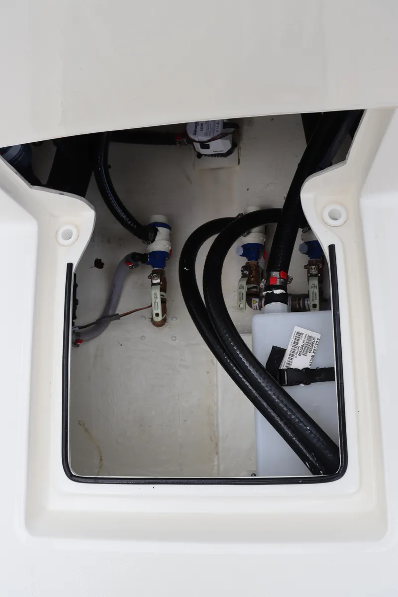 Slide: The Image of 2024 Pathfinder 2400 Open boat interior wiring and plumbing compartment. - 33
